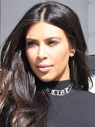 Kim Kardashian Wears 'Saint' Choker