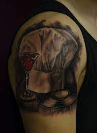 Black And Gray Realistic Tattoo Of Chefs Hat With Glass Of Wine By Angel Mihov Palitra Tattoo Sf Bg Portrait Tattoo Black And Grey Chefs Hat
