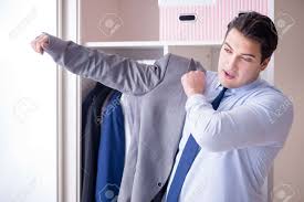 Young Man Businessman Getting Dressed For Work Stock Photo, Picture and  Royalty Free Image. Image 81838992.