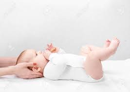 Six Month Baby Girl Receiving Osteopathic Or Chiropractic Treatment In Pediatric Clinic Manual Therapist Manipulates Chils S Head And Neck Stock Photo Picture And Royalty Free Image Image 136730276