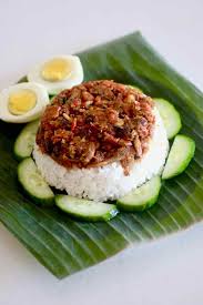 Plate np (sambal) nasi lemak + sambal udang ǀ nasi lemak with spicy prawns 250g 1 pinggan ǀ 1 plate (sambal) 427.992 np nasi lemak ayam goreng berempah ǀ nasi lemak + fried 290g 645 1 pinggan ǀ 1 plate np chicken with spice nasi lemak bungkus (daun pisang) ǀ nasi lemak packed. Nasi Lemak Traditional Indo Malay Recipe 196 Flavors