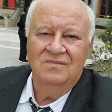 Player with four rackets.When you ask him why four ? He says there are four  kinds of players...attack,all round, defense and pimple or anti.So a man  with four rackets plays each style