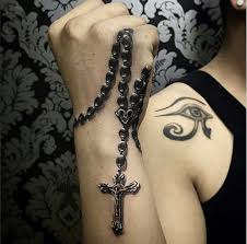 A common design is one with folded hands or praying hands holding the rosary with the beads wrapped around the hands or falling between the fingers.this tattoo can symbolize prayer, meditation, and deep spirituality. 65 Amazing 3d Tattoo Designs For Women Rosary Tattoo On Hand Rosary Tattoo Tattoos For Women