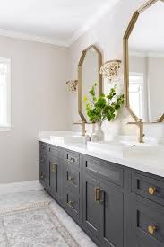 Black And Gold Bathroom Vanity Glass Droplets Sconces Flank A Gold Mirror Over A Black Bath Vanity Accented With Brass Hardware And A B Black Vanity Bathroom Bathroom Decor Bathrooms Remodel