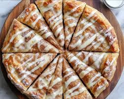 🍕✨ Cinnamon-Sugar Pizza made with Crescent Rolls ✨🍕 A sweet and easy  dessert pizza with a crispy crescent roll crust, topped with buttery  cinnamon-sugar goodness and drizzled with icing&mdash;a perfect treat for