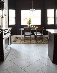 Set on a charcoal black base glaze, the contrasting design features a weathered, speckled look. Large Herringbone Tiles Bathroom Novocom Top