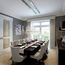 The cozy dining room offers beige high back chairs and a round dining table illuminated by a drum pendant light. Decorative Large Dining Room Table On Large Dining Table Houzz Large Dining Room Table Dining Room Small Dining Room Design