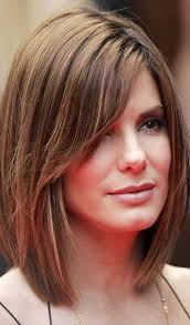 Long bangs and a layered cut are great for complimenting longer faces and adding fullness to your look. 5 Flattering Hairstyles For Long Faces Long Face Haircuts Oblong Face Haircuts Long Face Hairstyles
