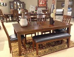 Ralene Dining Room With A Rich Rustic Beauty That Is Sure To Transform The Atmosphere Of Any Dining Area The Ralene Dining Dining Room Upholstered Chairs