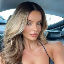 Adele looks *unrecognisable* with new wavy, bleach-blonde hair