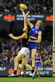 Next, swing back your kicking leg with your knee bent and hold up your hands for stability. Ruck Australian Rules Football Wikipedia