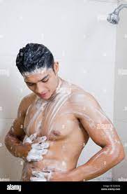 Close-up of a man taking a shower Stock Photo - Alamy