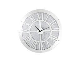 The clock face has a clean, modern look featuring roman numerals. Nowles Mirrored Faux Stones Wall Clock Harlem Furniture