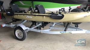 A tandem kayak is a kayak that can accommodate two people. Hobie Outfitter Customized On A Trailblazer Kayak Trailer Youtube