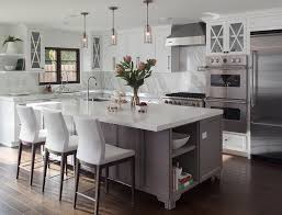 Gray Footed Center Island With White Leather Counter Stools Transitional Kitchen Kitchen Layout L Shape Kitchen Layout Kitchen Designs Layout