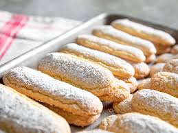 In a stand mixer, or using a hand mixer with the double beater attachment, whip 2 egg yolks and 1/2 of the granulated sugar until increased in volume, pale and fluffy. How To Make Ladyfingers The Fast Easy Way