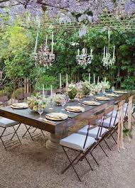 A few string lights, colorful chairs, table centerpieces, and a gathering table will make your outdoor space the happening spot in town. 29 Striking Outdoor Table Settings