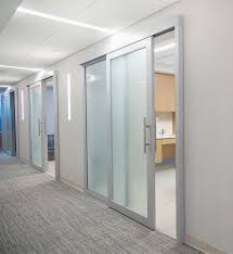 One transforms and enlightens workspaces with a minimalist profile, lightweight aluminum frame, and transparent glass. Office Sliding Glass Doors For Modern Workers Ad Systems Sliding Glass Door Glass Door Glass Wall Office