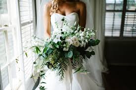 Romantic bouquet for wedding at hidden waters in waxahachie, texas. Loose And Organic Hand Tied Bridal Bouquet Of White Clematis White And Ivory Roses Whit Natural Bouquet Wedding Hand Tied Bridal Bouquet White Wedding Flowers