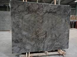 Giallo ornamental granite is a natural stone that evokes the warmth of a sunset, elegance, and this granite has different golden, beige and creamy tones with bronze, gray, and brown specs. Elegant Grey Marble Slabs Polished Grey Marble Slabs With Top Quality Marble Slabs