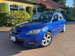 Image result for Electric Blue 2007 Mazda3