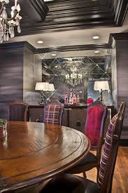 Perfect dining chair.light weight with big looks! Circular Wood Dining Table With Upholstered Solid Velvet And Plaid Chairs With Nailhead Trim In Gray Dining Room Hgtv
