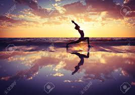 Yoga flow yoga meditation alo yoga hatha yoga kundalini yoga beginner yoga yoga for beginners yoga girls yoga inspiration. Silhouette Of Woman Practicing Yoga On The Beach At Sunset Stock Photo Picture And Royalty Free Image Image 44246231