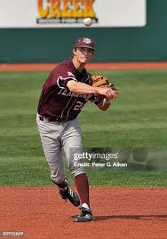 Dylan Petrich of the Texas A&M Aggies drives a base hit to left field...  News Photo