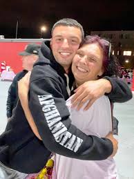 Son, Marine Corporal Mitch Haley surprises mom Diane Nazzaro during Saugus  football game