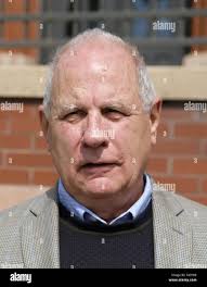 Catholic priest holds the child