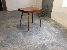 An art deco style marble top coffee table with a blanco equador marble top, on a solid brass base with tapered supports and a stretcher base. Art Deco Coffee Table By Halabala Model Spider Zeitflair