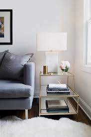 Tripod metal stand, roman numerals working clock inset in the tabletop is covered by tempered glass. How To Style Your Sofa Side Table Coco Kelley Living Room Side Table Side Table Decor Living Table