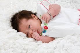A cute headband can always boost the gorgeousness of a curly haired girl! Baby With Brown Hair Laying On White Blanket Stock Photo Picture And Royalty Free Image Image 3829158