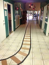 Polar Express Day Train Track On Floor At School Maybe A Butcher Paper Train On The Wall Too Polar Express Party Polar Express Theme Christmas Kindergarten