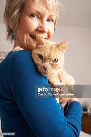 Senior Caucasian Woman Holding Cat High-Res Stock Photo