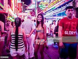Named after bangkok's famous red light district, soi cowboy, with all of it's neon lights and scantily clad girls, is many things to many people. People In Soi Cowboy Red Light District In Bangkok Thailand This Red Light District Bangkok Thailand Thailand Travel Bucket Lists