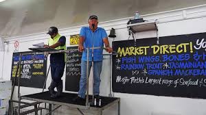 Busy day at AJ Langford's market city Perth.Where we have supplied fish too  for 4 generations. With buyers crowd around out there fishin, fresh fish  bid hard boys