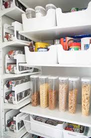 This pantry under the stairs features beadboard, open shelves, and plenty of organization. How To Organize A Closet Under The Stairs Pantry Organization Ideas