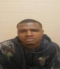 Suspect in custody, another at-large after body was found behind former  school in Moss Point