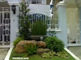 The back opens to beautiful views of the harbor, with a terraced patio running the length of the house. Front House Landscape Design Philippines