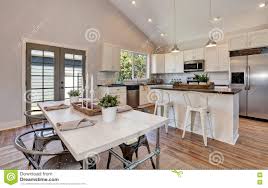 dining room with high vaulted ceiling