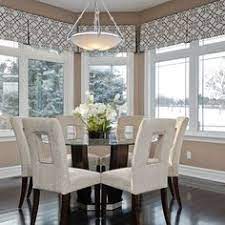 Bay window dining room designed with an industrial dining table and black slipcovered chairs atop tan travertine tiled floors. 68 Best Bay Window Treatments Ideas In 2021 Bay Window Treatments Bay Window Window Treatments