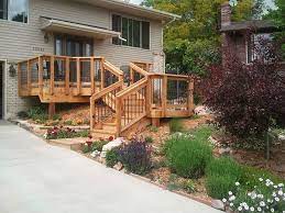 The landing in front of the shed is anchored to it with a ledger board using long lag screws. Front Entry Decks Decktec Outdoor Designs