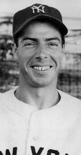 Joe DiMaggio eats a meal prepared by his mother, Rosalie, in 1934.