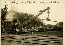 Northern Pacific Railway locomotive crane stacking rails in Brainerd,  1910?. Source: Crow Wing County Historical Society