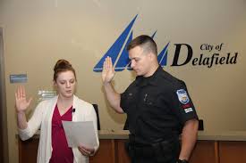 At the City Council meeting tonight Officer Mike Henning participated in  his ceremonial swearing in. City Clerk Michelle Luedtke swore Mike in and  Mike's wife Savannah pinned