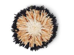 It sits on the wall and is amazing with its many shades and shapes. African Creative Juju Feather Hat