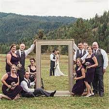 Pose your couple with their heads together, facing opposite directions with their eyes closed. 20 Fun Wedding Day Group Photo Ideas That Will Outshine Traditional Photos Weddinginclude Wedding Pictures Creative Wedding Photo Photo