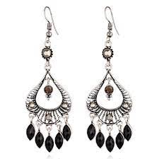 Hoop earrings also get an upgrade with adornments like mixed charms, beads and diamonds. Black And Silver Boho Chandelier Earrings Modern Silver Jewelry Silver Jewelry Design Womens Engagement Rings