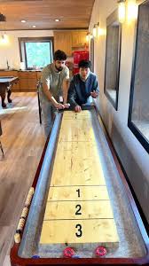 Table Shuffleboard With Pucks And Salt Stock Photo | Adobe Stock